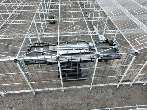 kas in aanbouw van bovenaf