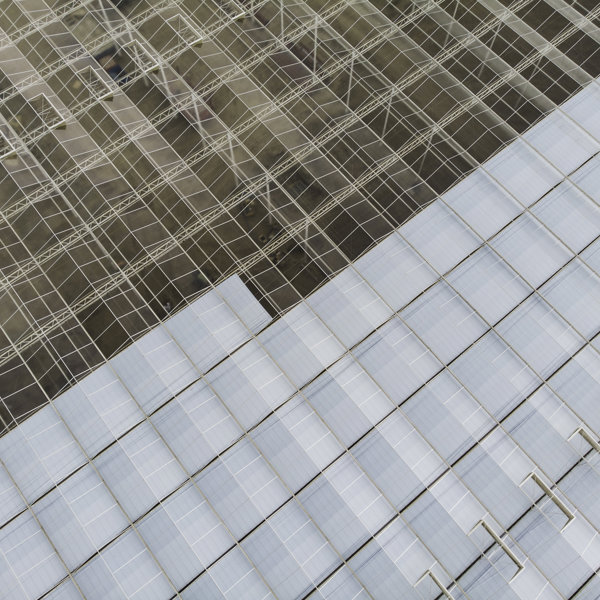 greenhouse roof half-glazed of greenhouse under construction from above